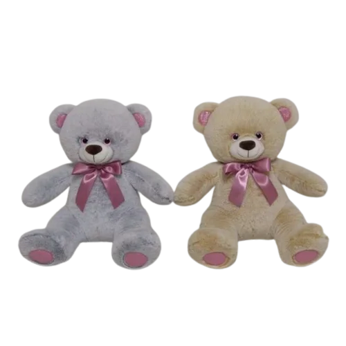 A soft teddy bear with a bow