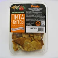 Pita crackers. Pita Chips (from Mediterranean pita) with tomatoes and herbs (100 g)