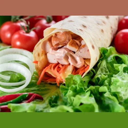 Shawarma in lavash with smoked chicken and vegetables