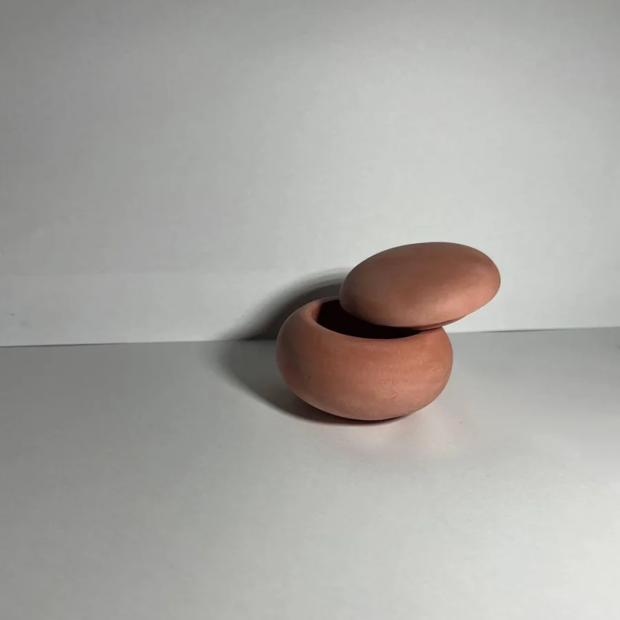 The "Stone" candle holder with a lid is red