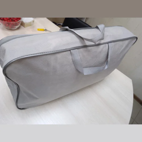 Packaging for blankets, pillows, down jackets with edging made of plastic edging Keder type Suitcase	